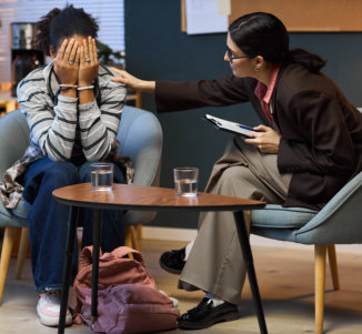 woman comforting the other woman